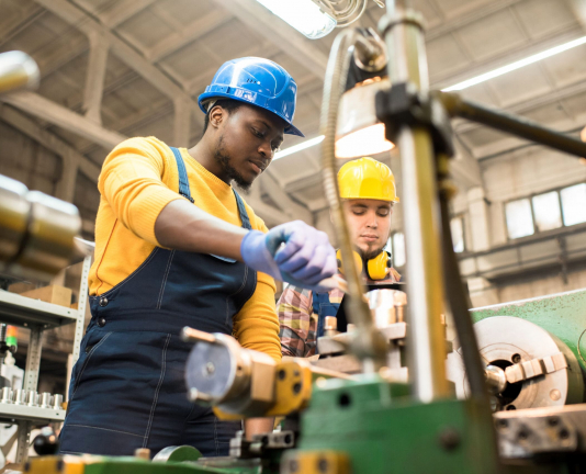 Lathe Operators Concentrated on Work