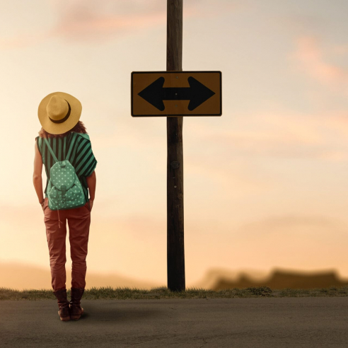 a backpacker woman traveler wondering for a way to go.